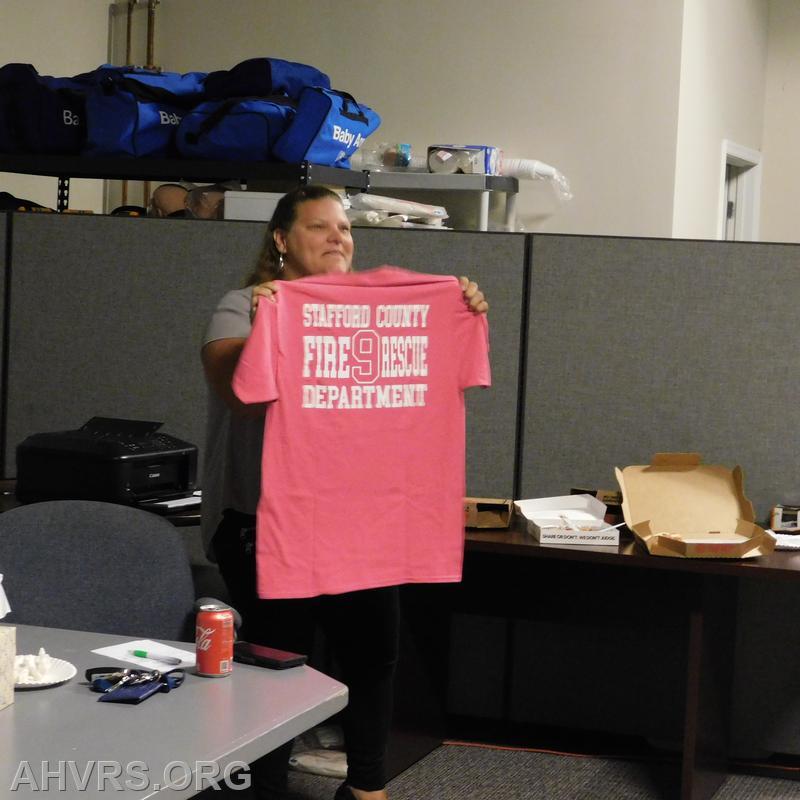 Agela, showing Breast Cancer Awareness shirt