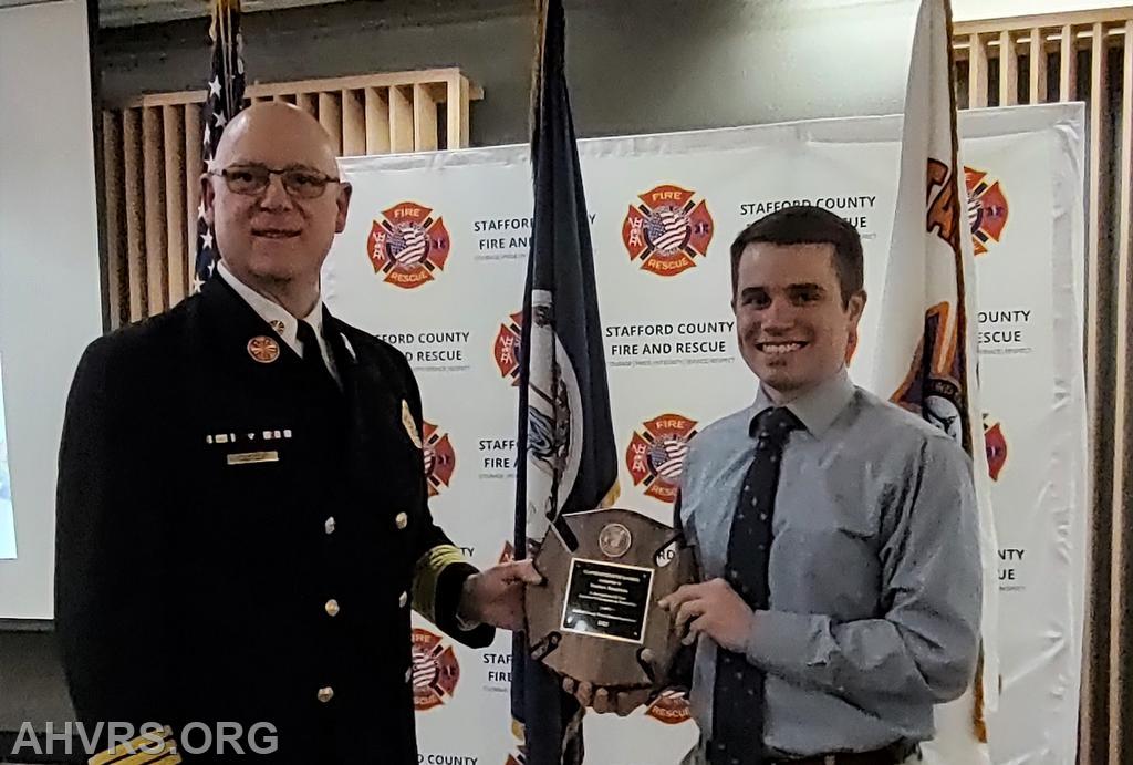 Matt Heindrichs receiving the Stafford County Volunteer Officer of the Year Award at County's annual dinner from Chief Joseph Cardello